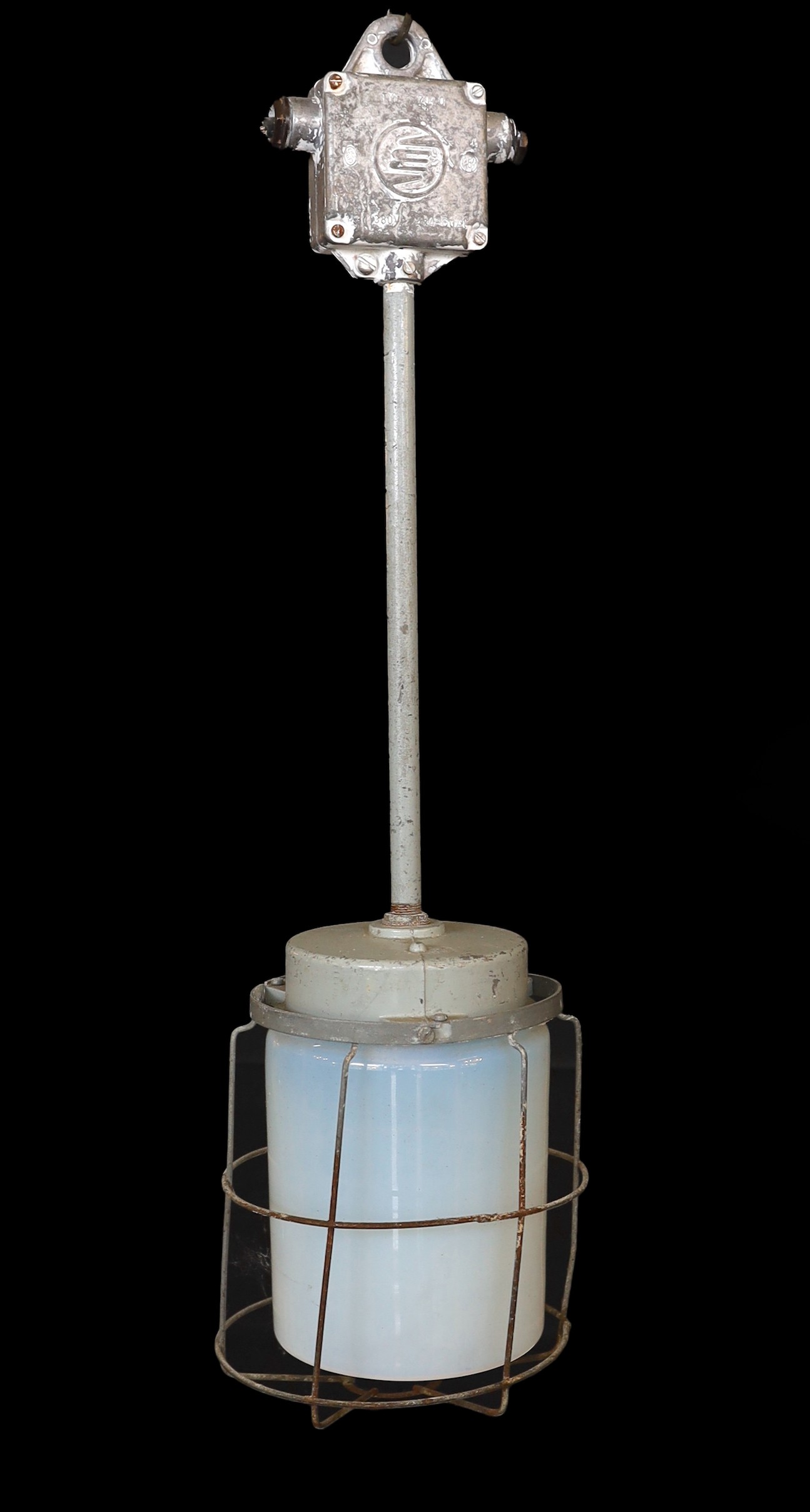 A pair of Czechoslovakian painted alloy industrial ceiling lights with caged Vaseline glass shades, height 74cm. width 21cm